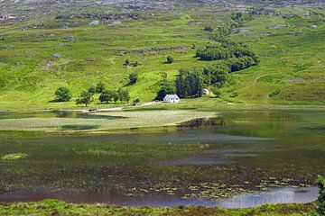 small lake at the foot of the mountain in scotland