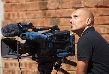 Cameraman in Zambia by Anjo Schuite
