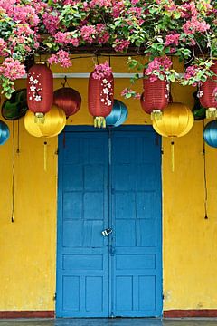 Traditional house with bright blue shutters by Frank Photos