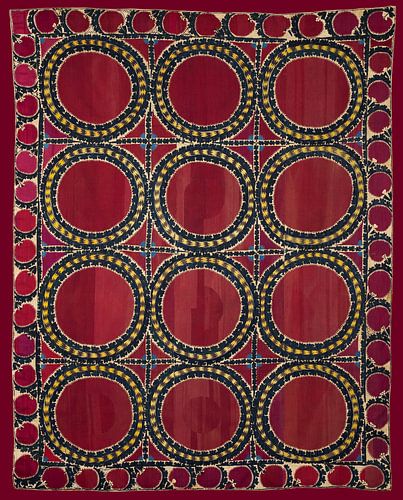 Vintage rood suzani tapijt. Geborduurd textiel. Aziatische kunst.