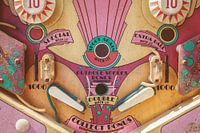 Close up of a weathered vintage pinball machine
