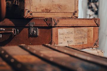 Old suitcases at French antiques market by Melissa Peltenburg