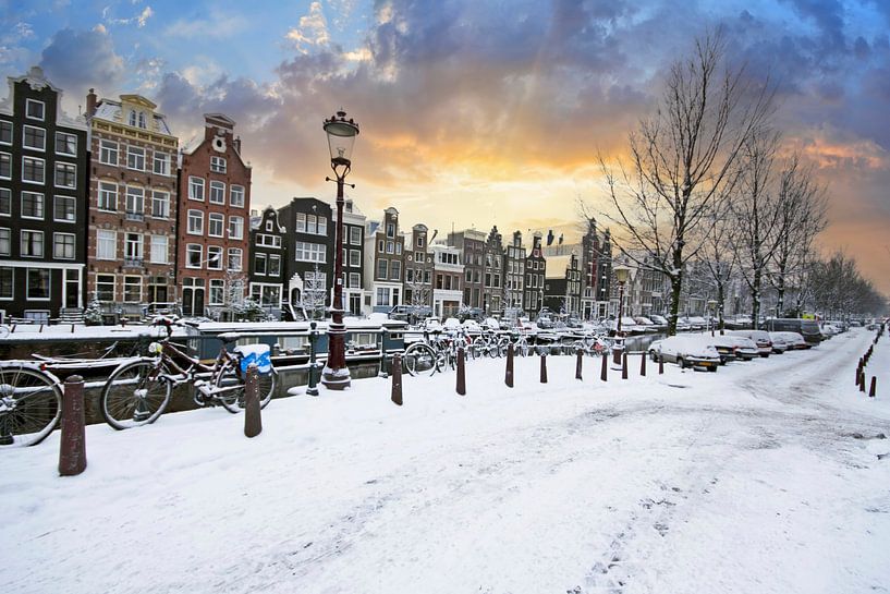 Snow-covered Amsterdam in winter in the Netherlands at sunset by Eye on You