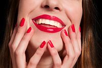 smiling female mouth with hands