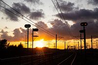 Zonsondergang boven het spoor