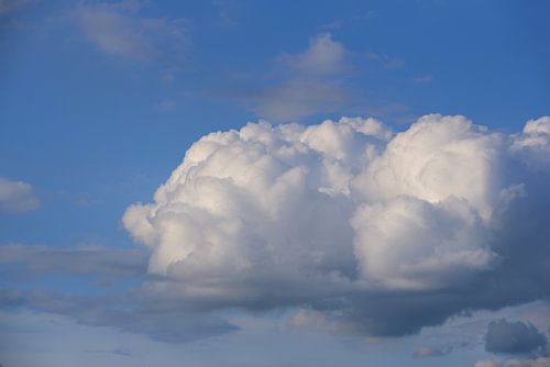 A white cloud against a blue sky
