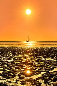 Sonnenuntergang über dem Wattenmeer bei Koehoal in Friesland