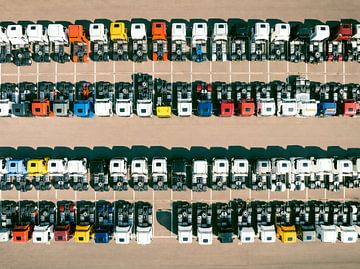 Trucks in a row at a parking lot seen from above