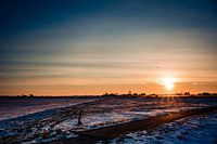 Zonsopgang met sneeuwlandschap