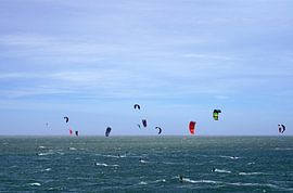 Windsurfers on the North Sea near the Brouwersdam in Zeeland by Rob van Hilten