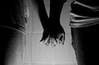Lovingly holding hands