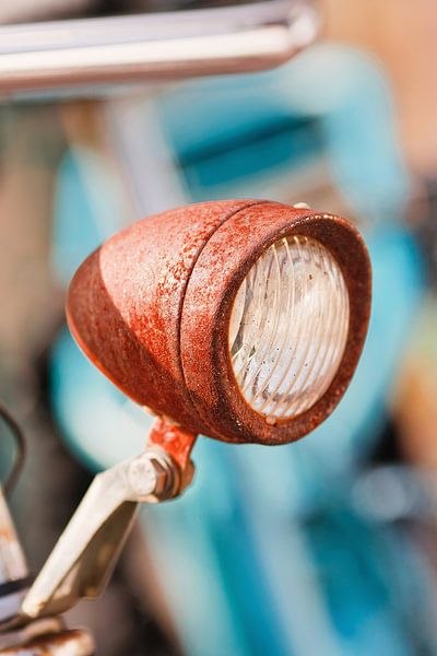 Rusty bicycle headlamp on a sunny day by Tony Vingerhoets