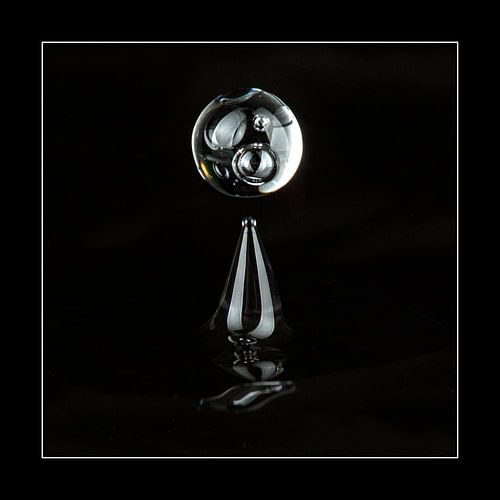 Abstract image of a falling water drop. Black background.