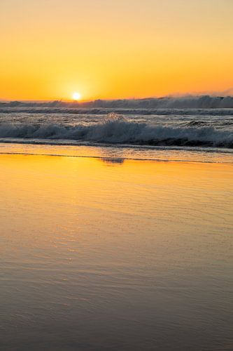 Waves on the beach at sunset
