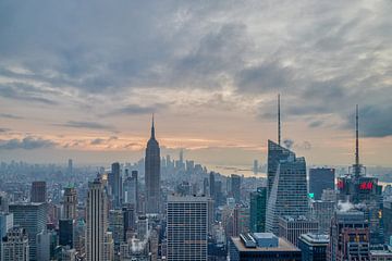 New York skyline from the top of  the Rock (Rockefeller Center)sunset view in Winter with clouds in  by Mohamed Abdelrazek