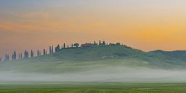 A dance of light and mist - the Crete Senesi in the first glow of the day by Walter G. Allgöwer
