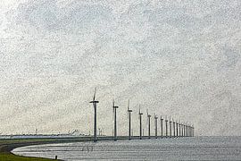 Long row of windmills on the shore of a lake