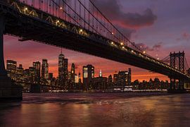 Skyline of Manhattan and Manhattan Bridge at sunset, New York, USA by Markus Lange