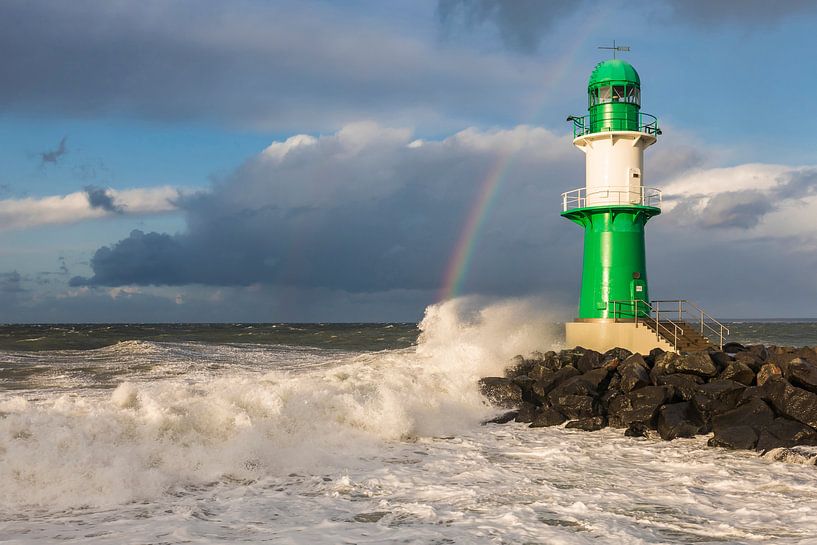 Lighthouse in Warnemunde during storm by Werner Dieterich