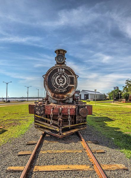 Old rusted steam locomotive in Encarnacion, Paraguay by Jan Schneckenhaus