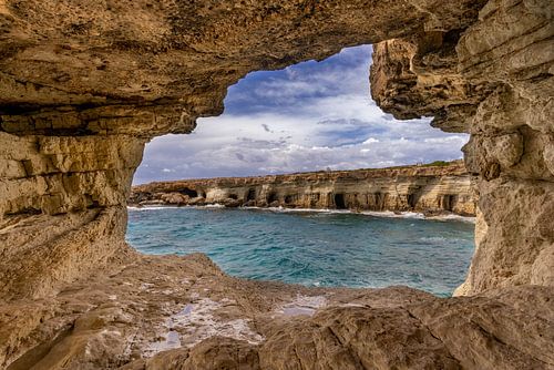 Cave with a view of the rocky coast