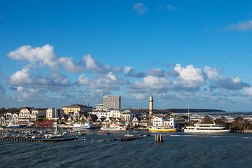 View to buildings and blue sky in Warnemuende, Germany by Rico Ködder