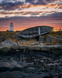 Sunset at lighthouse with old boat on Vigra, Ålesund, Norway by qtx