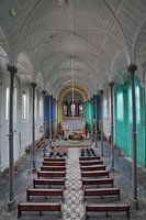 Urbex dilapidated church with arches and colors.