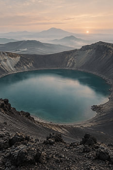 Volcanic Eye: Turquoise Crater Lake at Golden Dawn