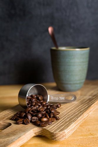 Coffee beans and a cup