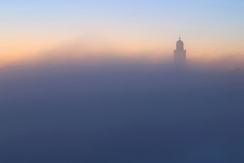 Tower of Lebuïnus Church Deventer in the mist by Ronald Pol