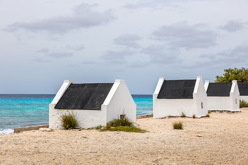 Historic slave huts by the sea on Bonaire