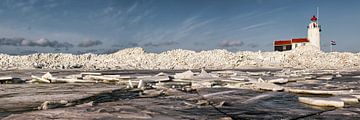Ice shove at the lighthouse on Marken, the Netherlands. by Frans Lemmens