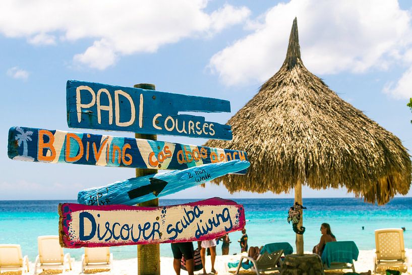 Beach signs with parasol, Curacao by Paul van Putten