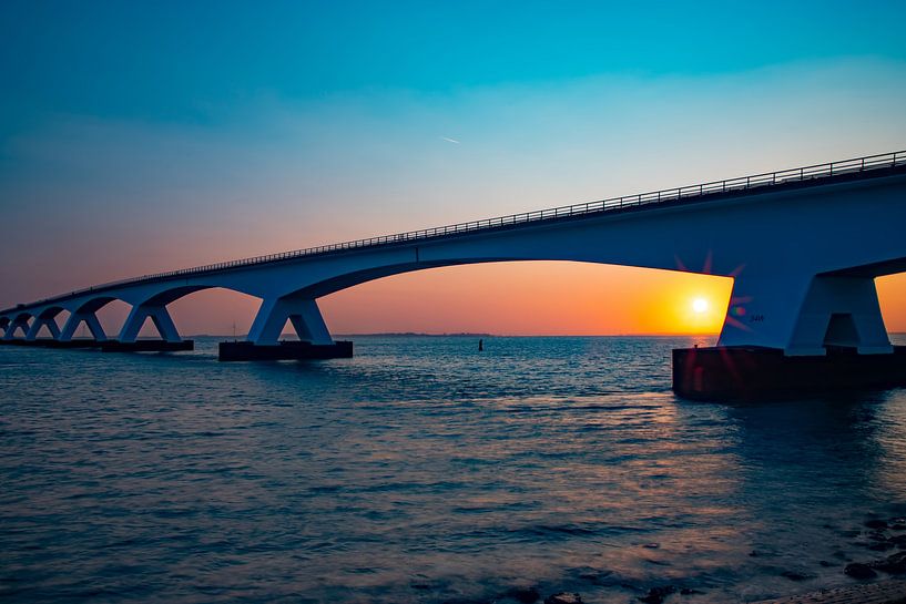 The Zeelandbrug, Zeeland (Netherlands) at sunrise. by Gert Hilbink