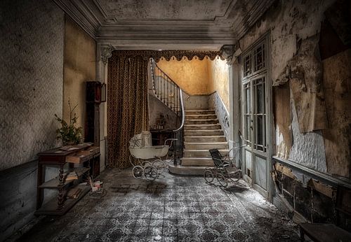 Baby carriage on abandoned staircase