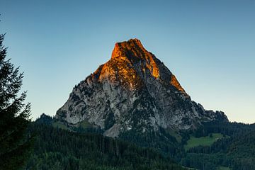 The Schwyz mountains Grosser and kleiner Mythen in Central Switzerland shine with alpenglow