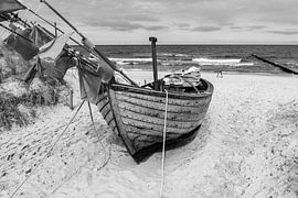 Black and white photography fishing boat at the Baltic Sea on the beach by Animaflora PicsStock
