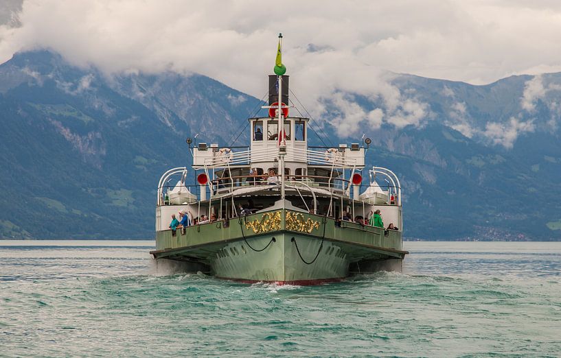 A ferry, to be precise made a paddle steamer in Spiez, Switzerland by Angelo de Bruin