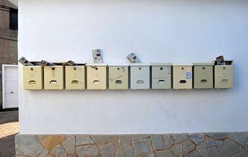 Mailboxes on the wall, Corse by Ingrid Bargeman