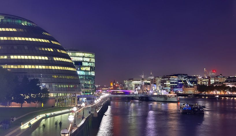 Night image of London skyline with reflections on the Thames - business district with many colorful  by MPfoto71