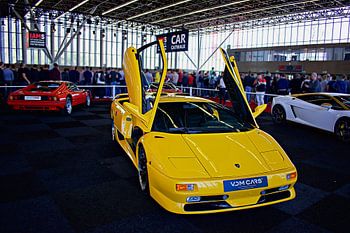 Yellow Lamborghini Diablo with its scissor doors open