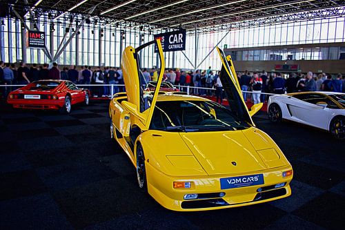 Yellow Lamborghini Diablo with its scissor doors open