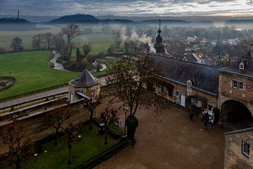 Chateau Neercanne from the Canner mountain with a view on the misty Jeker valley in Maastricht by Kim Willems