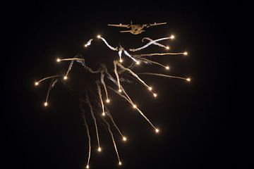 Romanian C-27J Spartan transport plane fires flares in the dark by Arjan Dijksterhuis