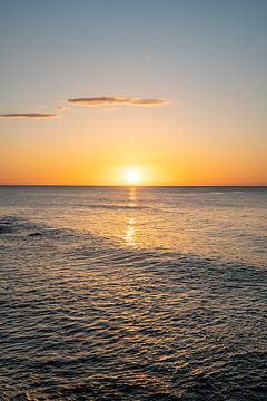 Sunrise on the beach on the coast of Sardinia with glittering sea by Leo Schindzielorz