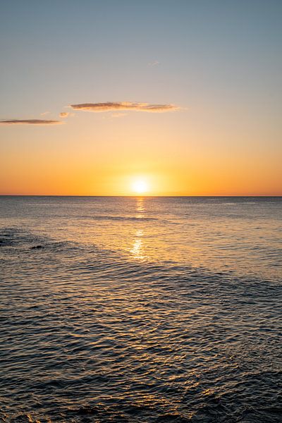 Sunrise on the beach on the coast of Sardinia with glittering sea by Leo Schindzielorz