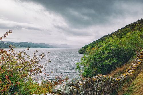 Loch Ness in Scotland. Deserted idyll at the stone wall of Urquhart Castle.