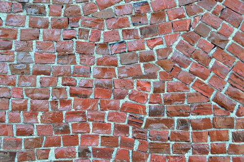Mozaïeksteentjes van een muurschildering in Berlijn