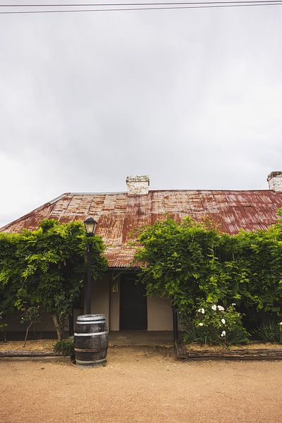 Abandoned hotel taken back by nature. by Ken Tempelers